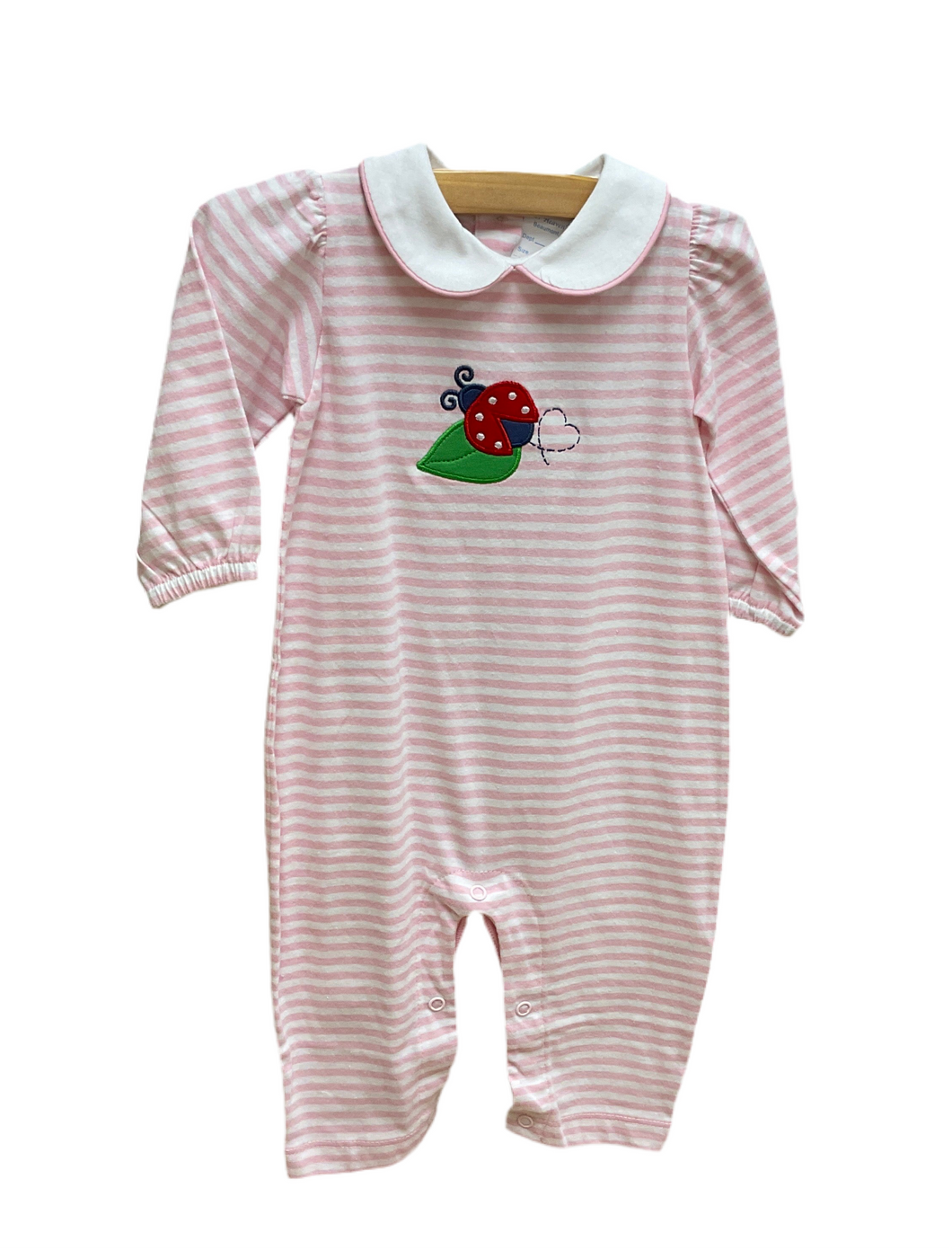Pink stripe romper with ladybug